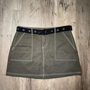 Khaki mini skirt with white stitching and black belt